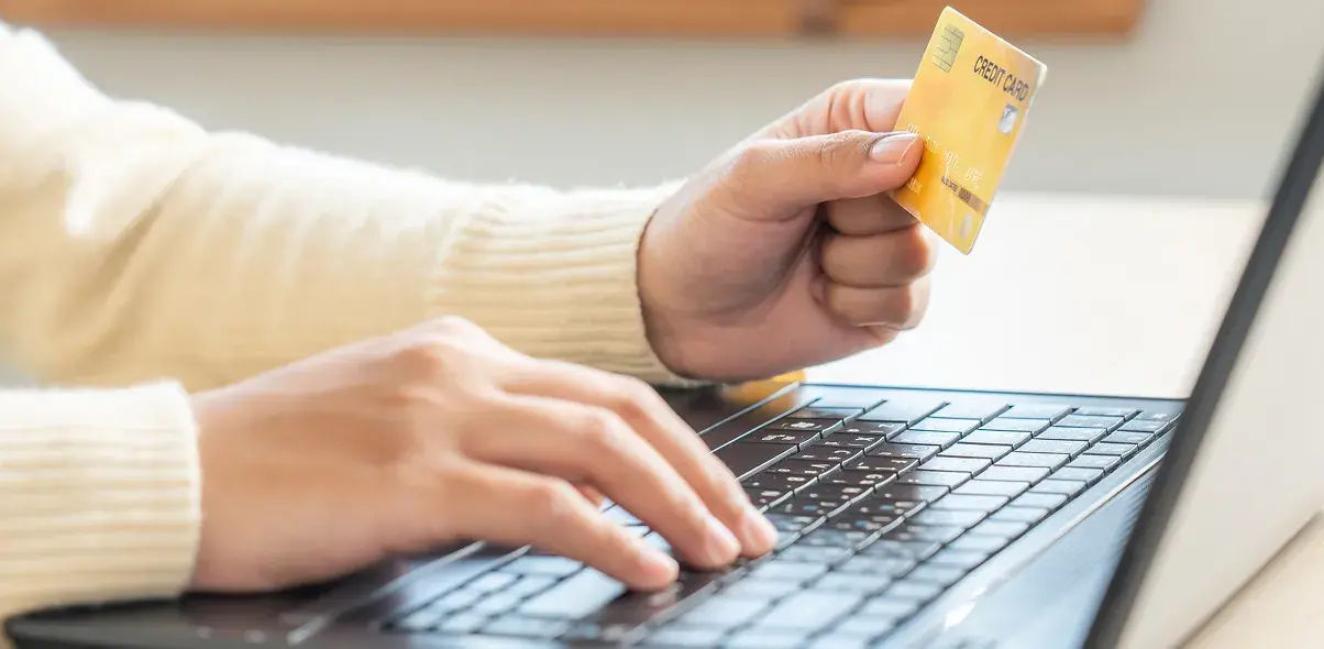 a-person-using-laptop-input-data-for-credit-card-o-2023-11-27-05-13-10-utc 1